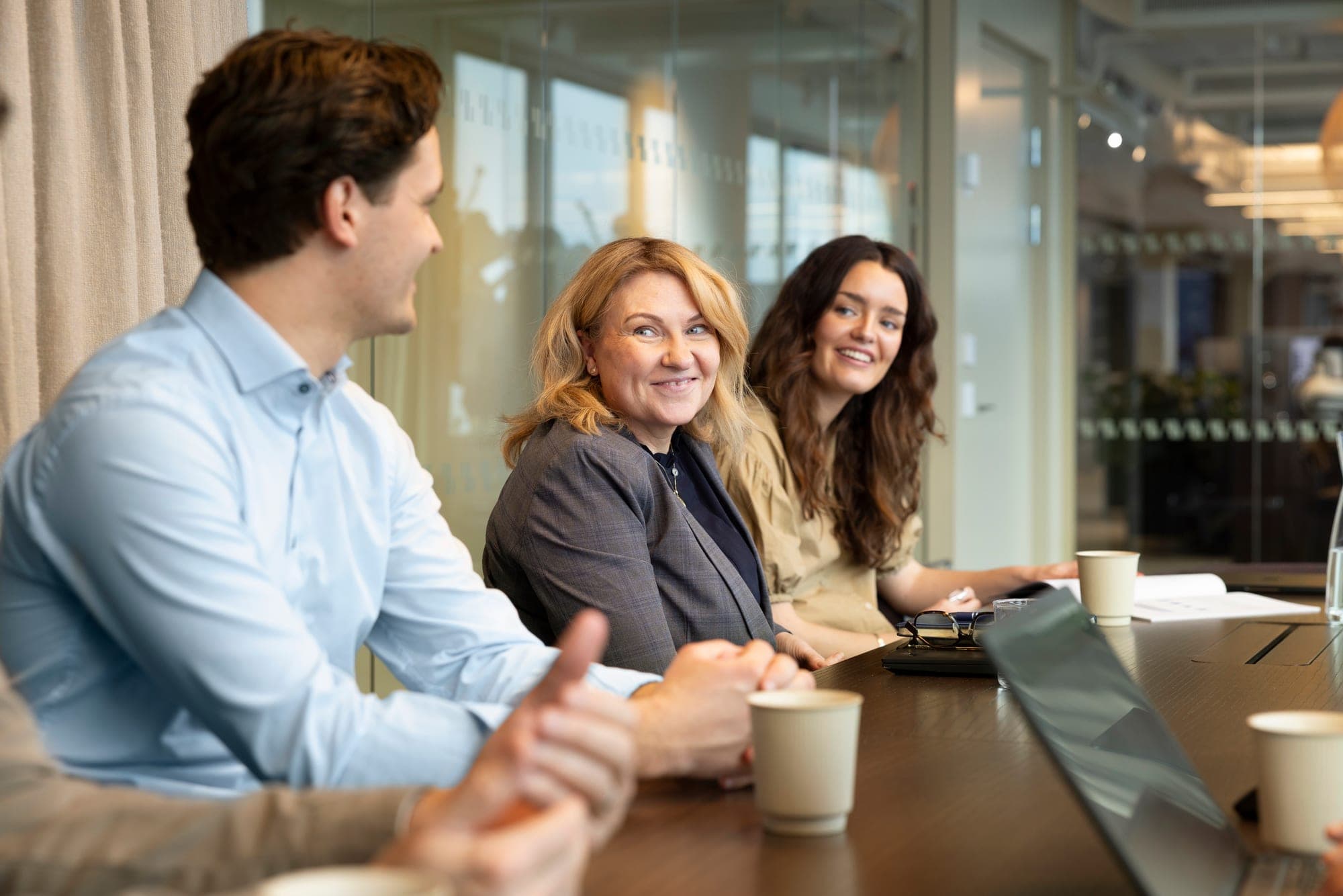 Allshares equity specialists talking around a table
